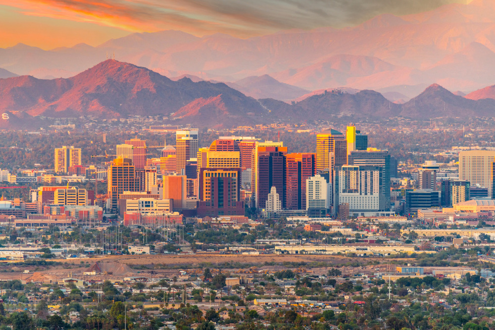 A view of the Phoenix, AZ, skyline at sunset. Phoenix is one of the best places to live in Arizona.