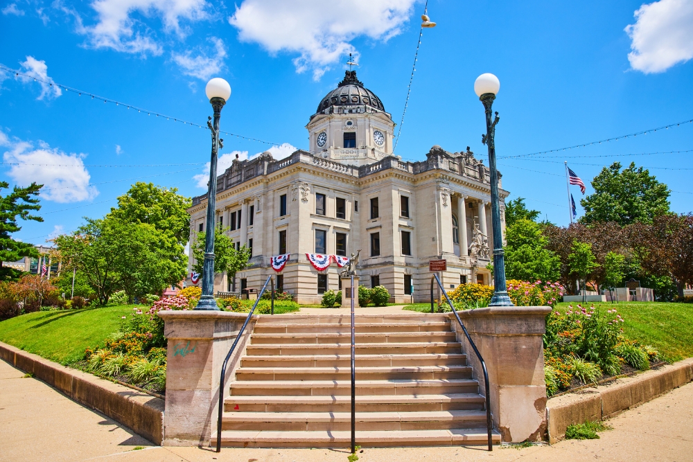 A wide image of the corner steps outside of the Bloomington, Indiana courthouse. Bloomington is a great place to live in Indiana.