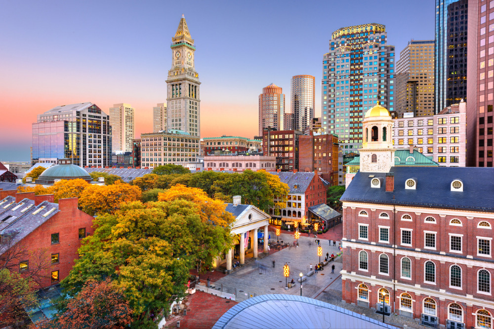 A view of the Boston, MA, skyline overlooking Faneuil Hall and Quincy Market. 