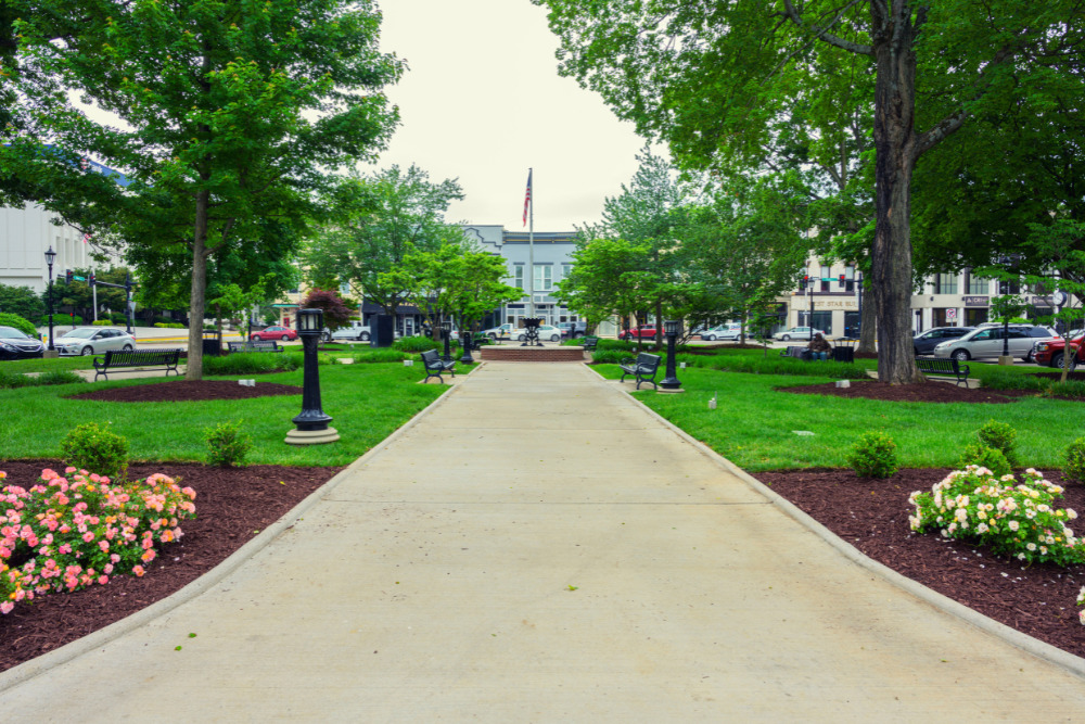 A walkway surrounded by gardens in downtown Bowling Green, Kentucky. Bowling Green is a great place to live in Kentucky.