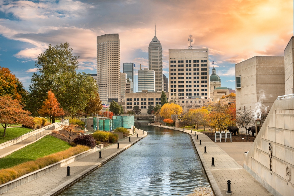 The downtown city skyline view of Indianapolis, Indiana, looking over the Central Canal Walk. Indianapolis is one of the best places to live in Indiana.