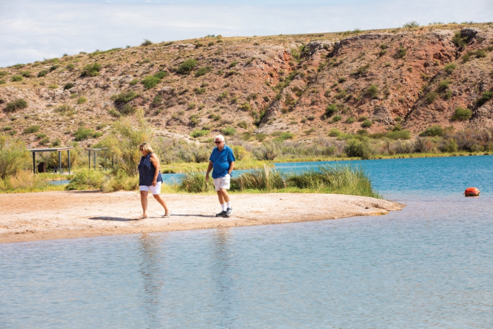 A couple walks around the Lea Lake area of Bottomless Lake State Park near Roswell, N.M. Roswell is one of the best places to live in New Mexico.