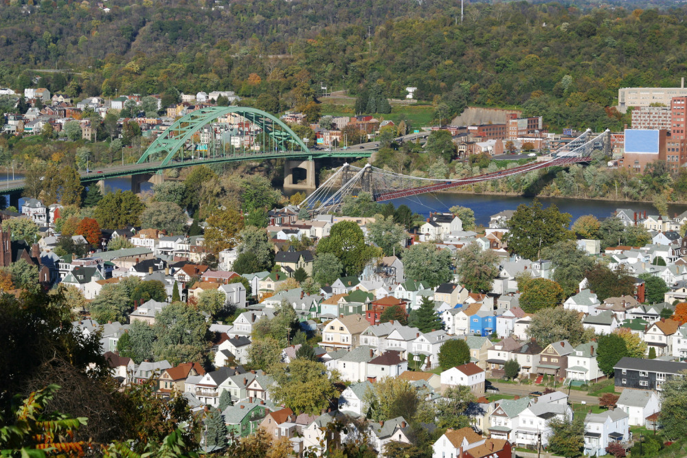 A view of neighborhoods overlooking the Ohio River in Wheeling, WV. Wheeling is one of the best places to live in West Virginia.
