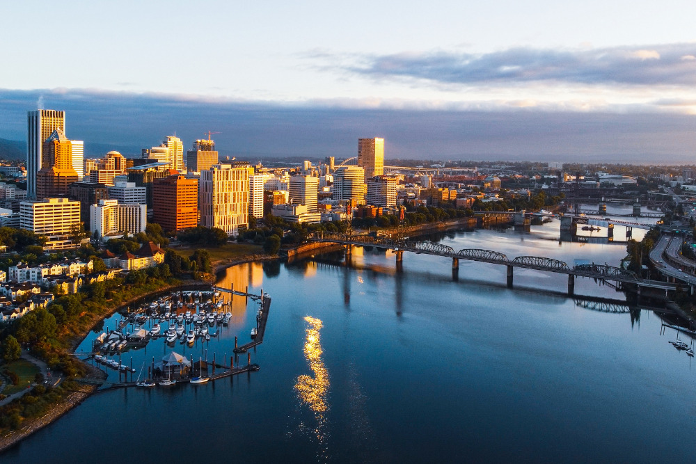 A skyline view of Portland, Oregon, at sunrise. Portland is one of the best places to live in Oregon.