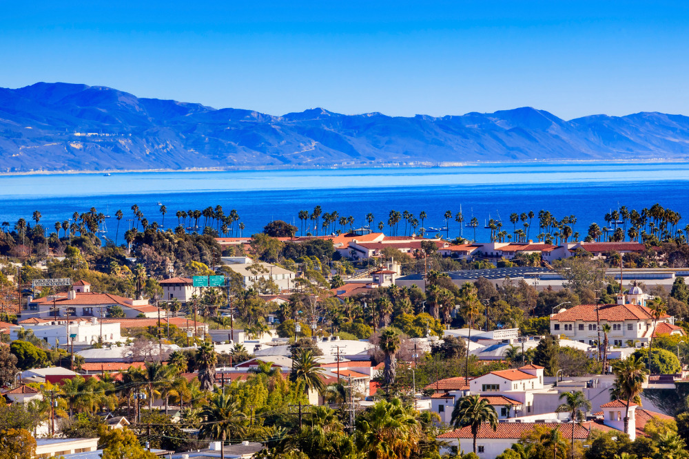 The Pacific Ocean is seen beyond terra-cotta rooftops in Santa Barbara, California. Santa Barbara is a great place to live in California.