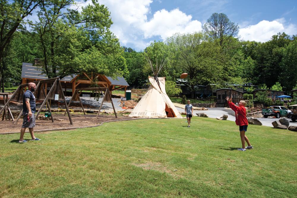 Families spend time outdoors at Little Arrow Outdoor Resort in Townsend, TN.