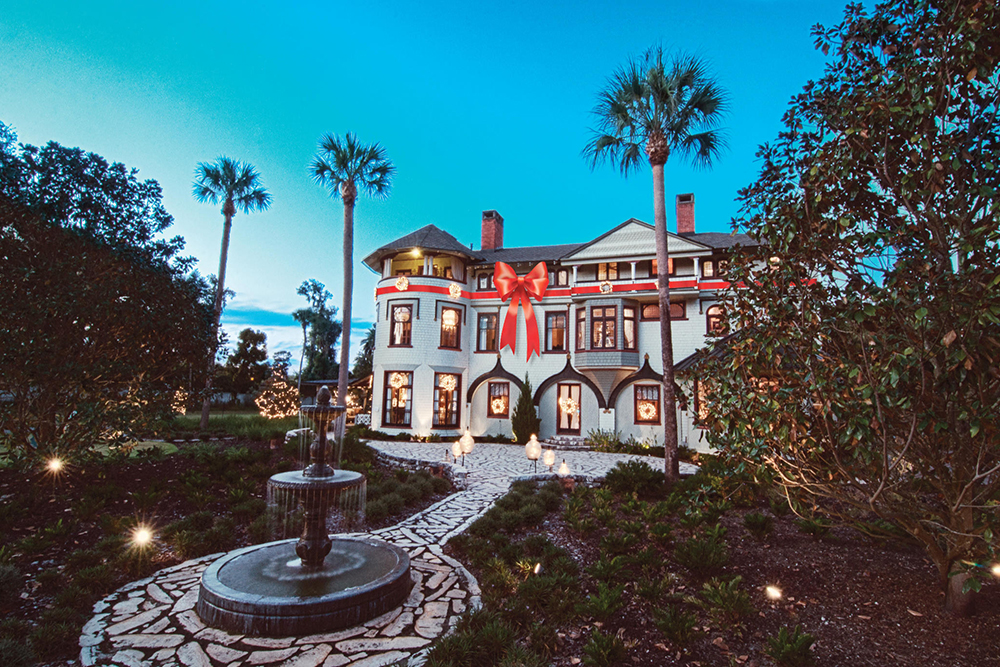 Stetson Mansion lit up at night during the holidays. Any list of things to do in West Volusia should include a visit to this unique estate!