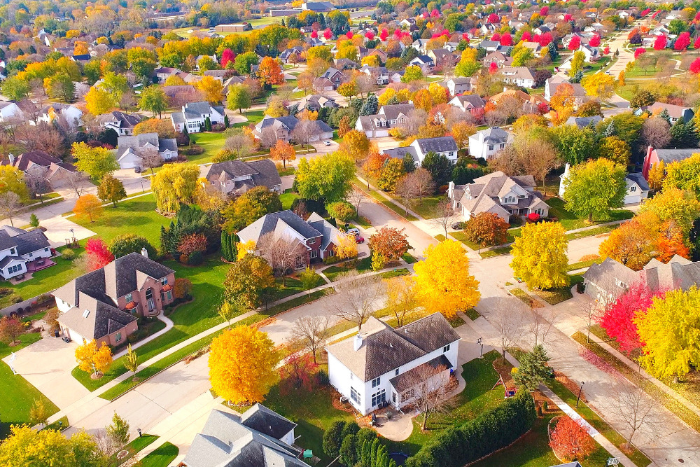Breathtaking aerial view of idyllic neighborhoods richly colored with colorful Autumn trees in Appleton, Wisconsin.