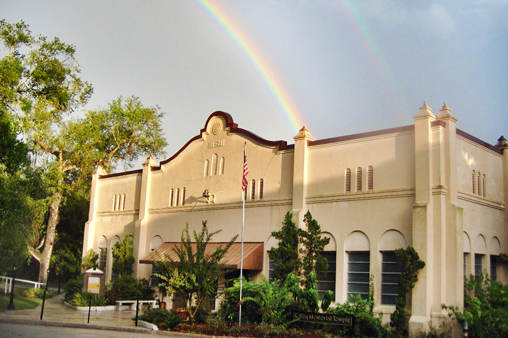 A double rainbow is seen behind the facade of Cassadaga Spiritualist Camp in central Florida.