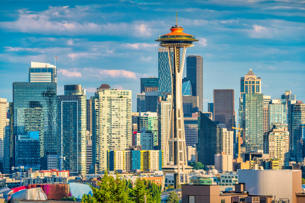 The skyline of Seattle, Washington, with the Space Needle observation tower on a sunny day.