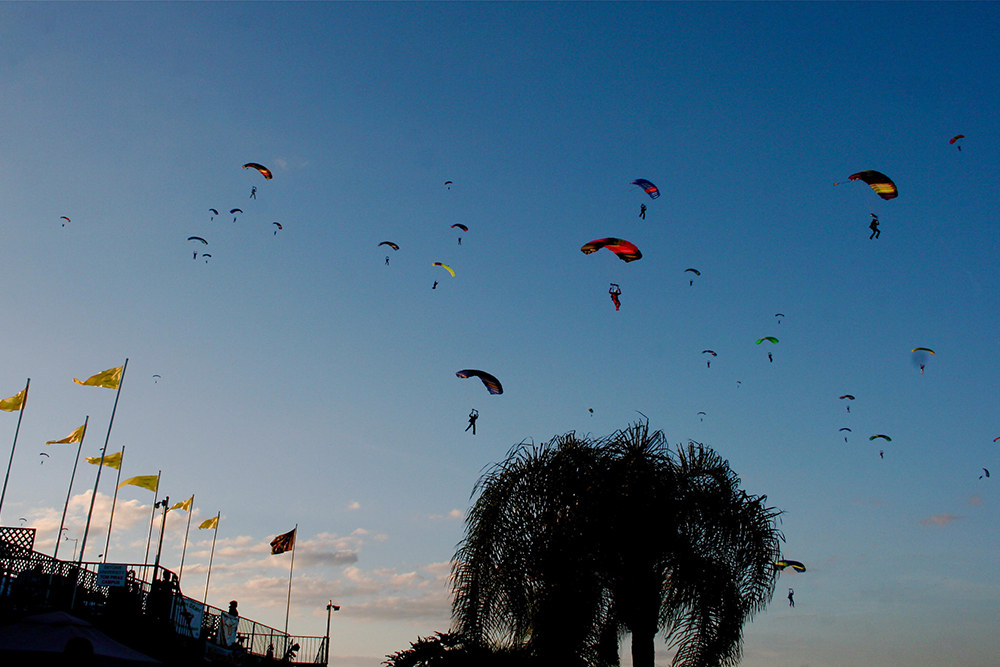 Dozens of skydivers dot the sky at Skydive DeLand in central Florida, one of the busiest “dropzones” in the world.