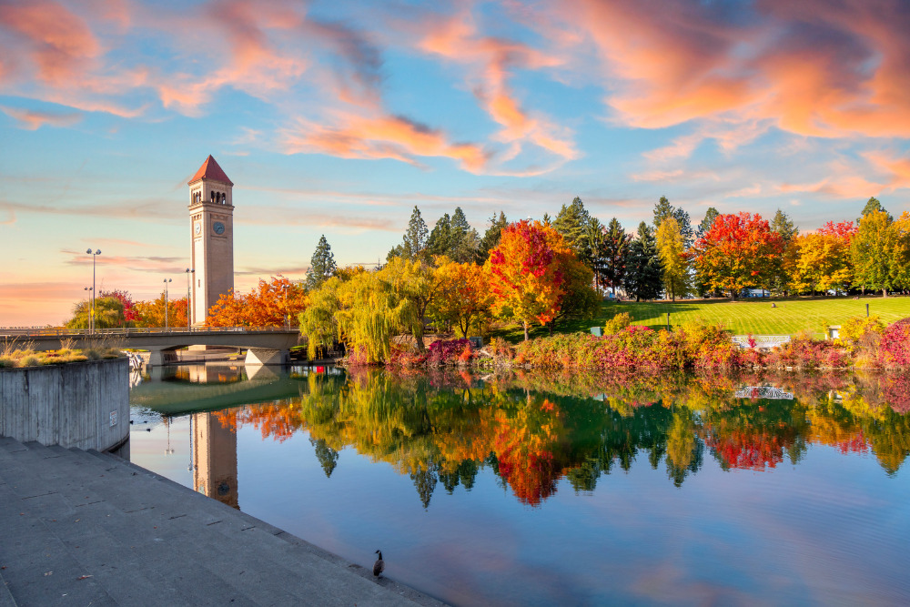 Vivid fall colors highlight the beauty of the riverfront park along the Spokane River in Spokane, WA. Spokane is a great place to live in Washington.