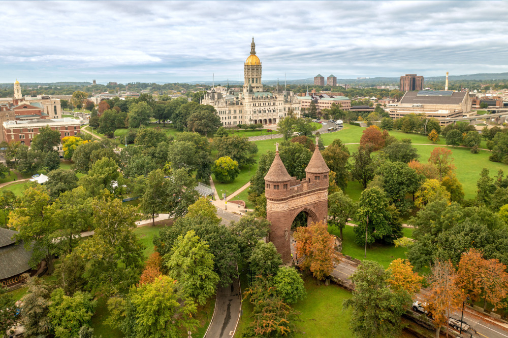 Aerial view of the Connecticut State Capitol Building and Bushnell Park in Hartford, CT. Harford is one of the best places to live in Connecticut.