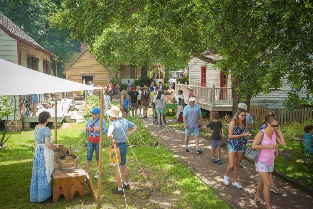People gathered at the Historic Pensacola Village.