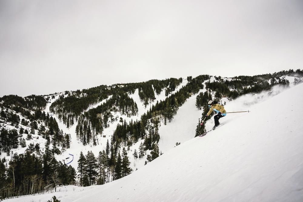 A skier on a snow covered mountain