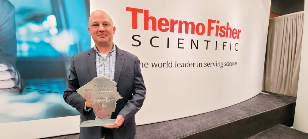 Thermo Fisher Scientific official with Pitt County Industry of the Year award