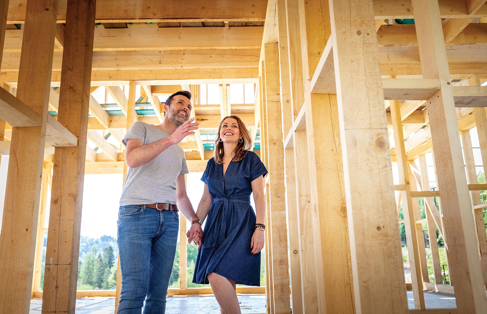Couple in framework of new home