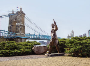 Roebling Bridge and statue on riverfront