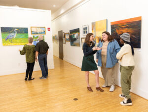 Lauren Luther chats with patrons of the arts.