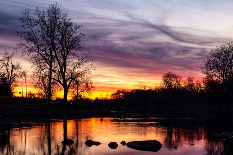 Photo of a sunset over water in Muncie, Indiana.