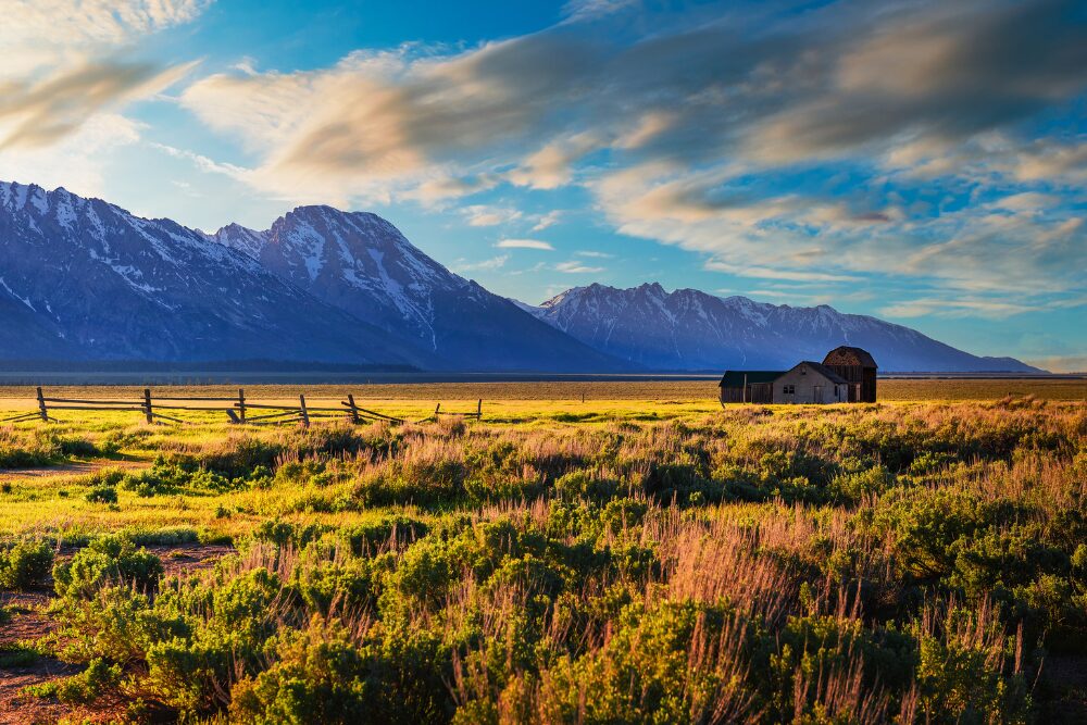Sunset over a historic farm at Mormon Row in Grand Teton National Park, Wyoming. Wyoming is one of the best states for retirees.