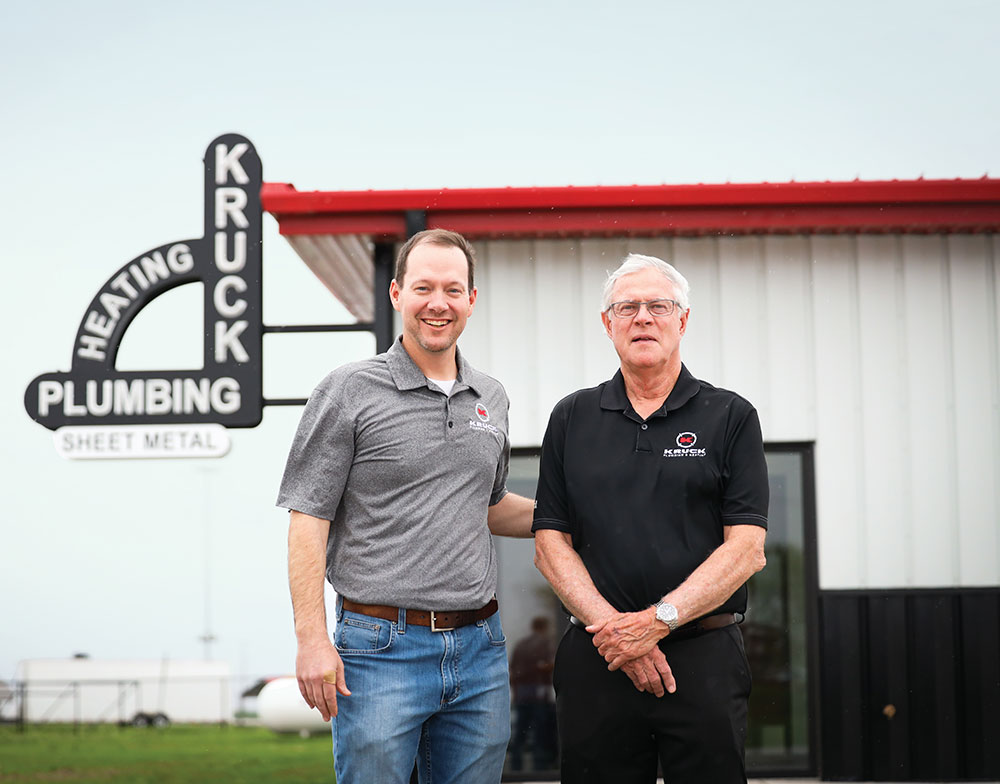 Chad Houston of Kruck Plumbing and Heating with previous owner Steve Kruck