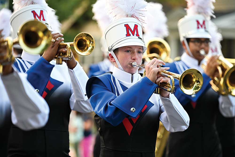 Marshalltown Community School District band members play during a parade.