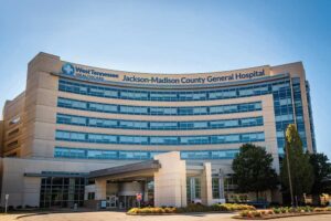 New West Tennessee Healthcare Jackson-Madison County General Hospital sign on A Tower entrance photographed from University of Tennessee Family Medicine roof.
