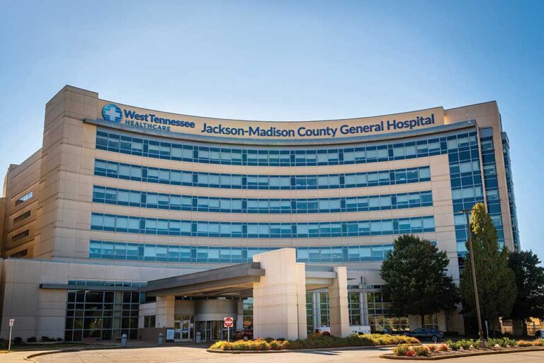 New West Tennessee Healthcare Jackson-Madison County General Hospital sign on A Tower entrance photographed from University of Tennessee Family Medicine roof.