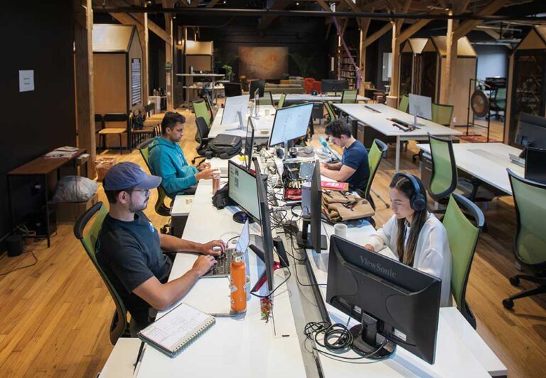 Chattanooga talent is top-tier and those relocating to the area find economic opportunities. Alfredo Ramirez, left, and Gabriella Mutti work on the start-up Prosal in their space inside the Brickyard in Chattanooga. ©Journal Communications/Nathan Lambrecht