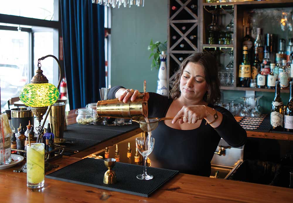Raven Humphrey makes a Solei Levant drink at Calliope in Chattanooga, one of the new Chattanooga restaurants focused on international cuisine. ©Journal Communications/Nathan Lambrecht