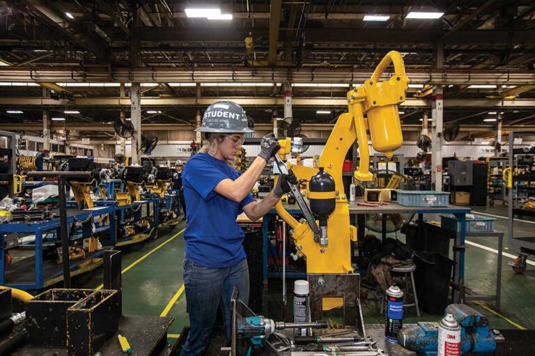 Komatsu pre-apprenticeship program student Caitlee Arms makes a part for an excavator in Komatsu America Corporation’s manufacturing plant in Chattanooga. The apprenticeship program is targeted at filling Chattanooga manufacturing jobs.