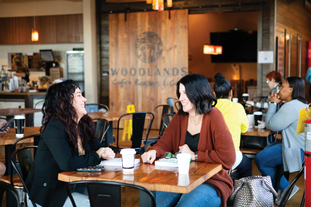 Dani Lassetter, left, and Anita Driggers visit at a table at Woodland Coffee Roaster and Cafe in Kathleen.  