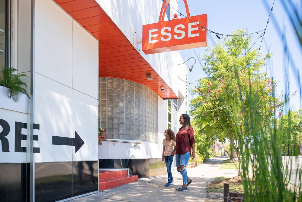 A mother and daughter enter the ESSE Purse Museum & Store in Little Rock AR.