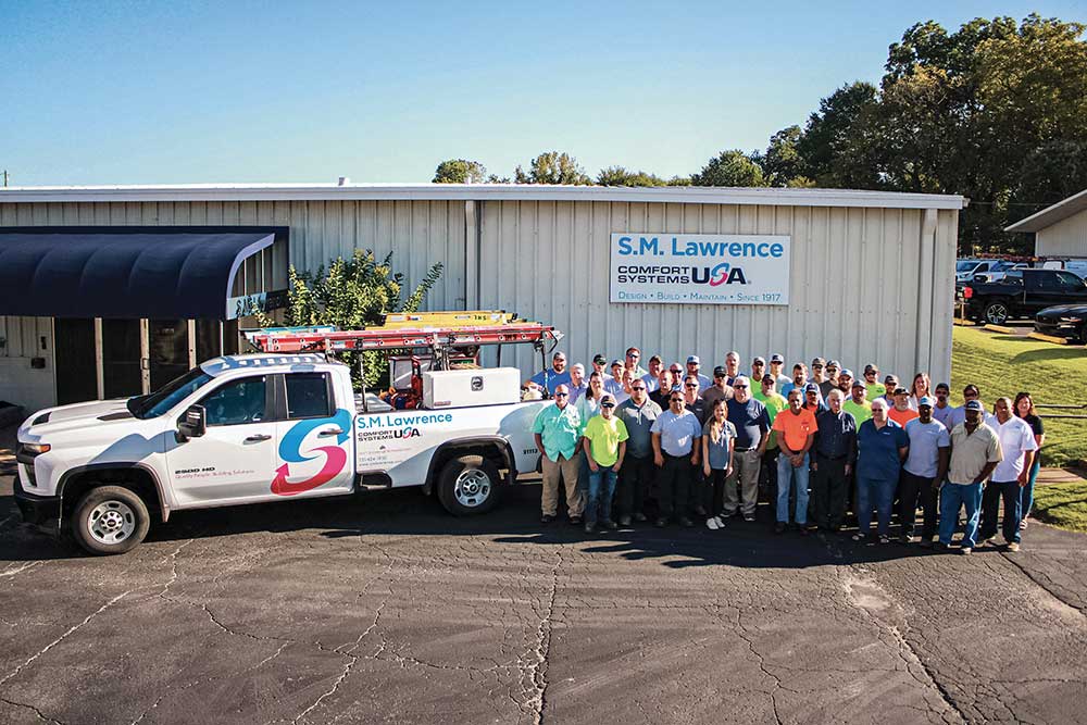 Employees stand outside of the S.M. Lawrence building in Jackson, TN. S.M. Lawrence was founded in 1917.