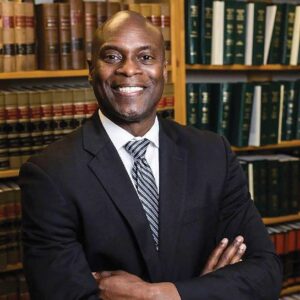 Headshot of Wade Hinton, whose company Hinton & Co. works with businesses to design diversity and inclusion programs, speaks about DEI best practices and advice he gives to companies beginning their DEI journey.