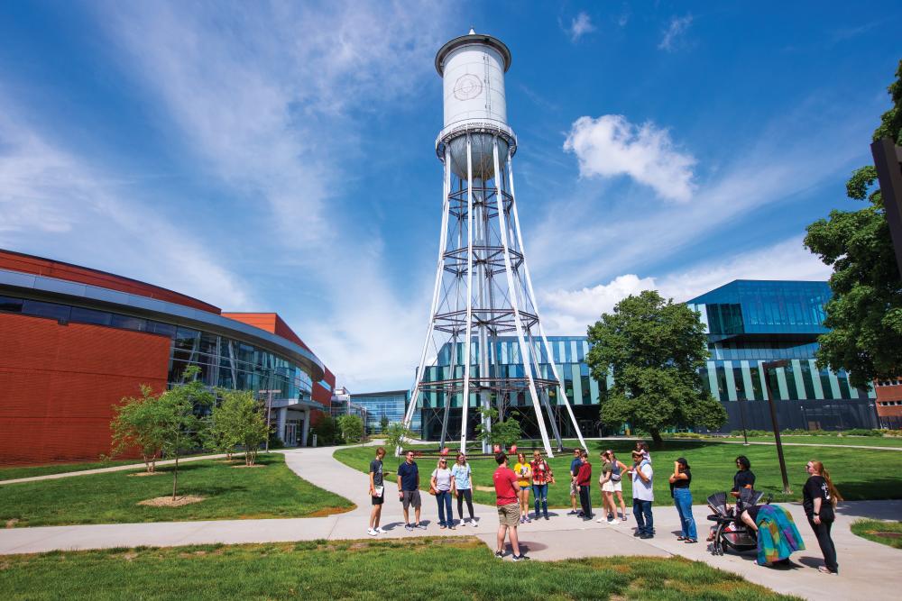 Campus tour stop in front of the Marston Water Tower, the Student Innovation Center and Hoover Hall, June 3, 2024. (Christopher Gannon/Iowa State University)