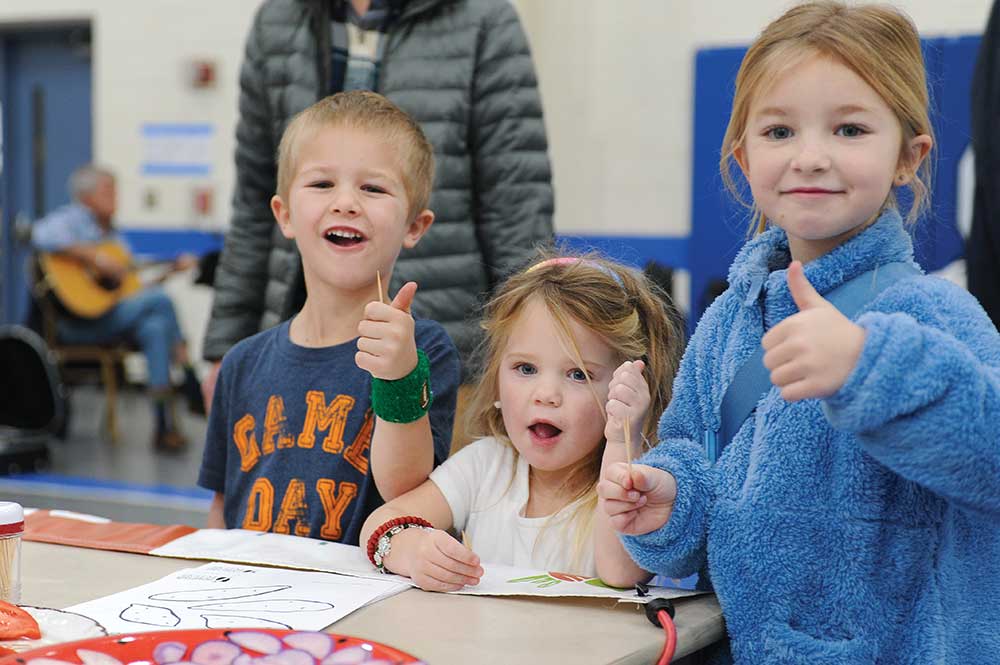 Children completing arts projects at the Grow Oak Ridge Winter Farmers Market.