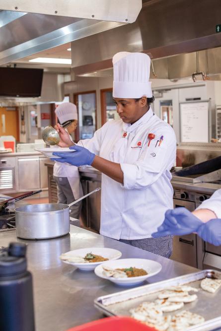 A Baker College student in the culinary program.