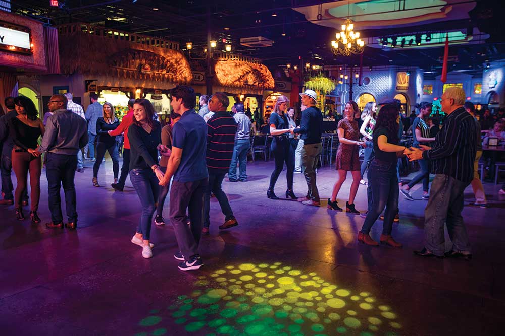 Visitors learn to salsa dance during the free Thursday night salsa lessons at Plaza Mariachi in Nashville, Tennessee.