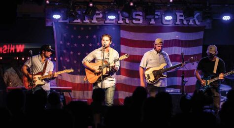 Jake Matthew and his band performs during the open mic night show at Fox and Locke in Leipers Fork.