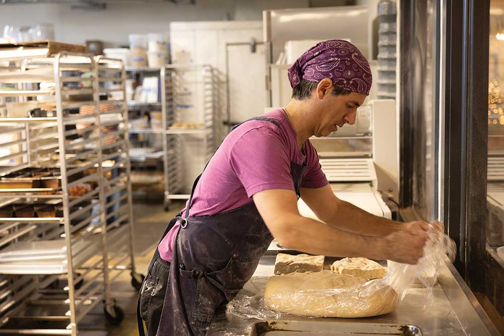 Bakers make baked goods at B's Salty & Sweet Bakery & Cafe at The Factory at Columbia in Columbia, Tennessee.
