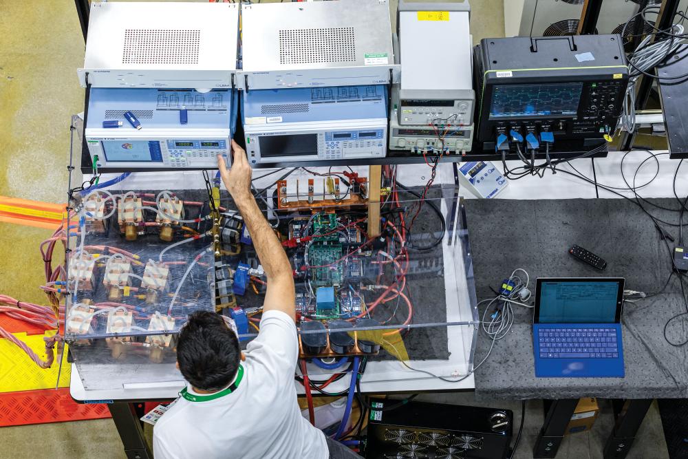 Demonstration at GRID-C of the 270-kilowatt wireless power transfer project for the Porsche Taycan electric vehicle, May 22, 2024.