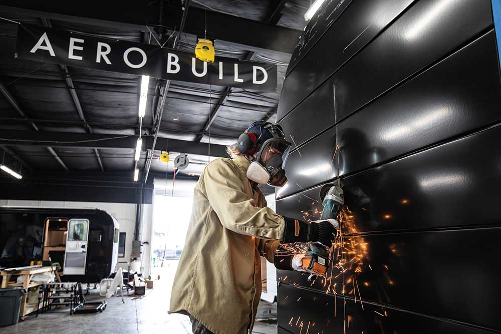 A hole is cut into the side of a trailer for the window at Aero Build in Nashville.