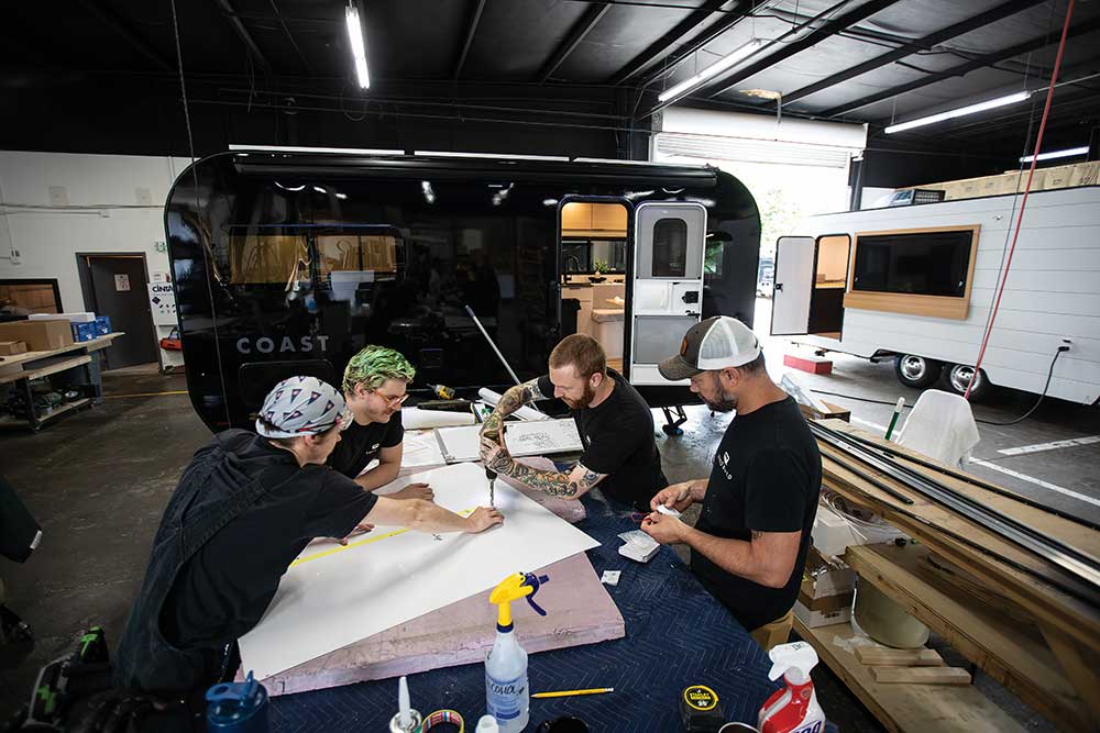 Workers cut a hole in an interior panel for an all-electric Coast travel trailer in Nashville.