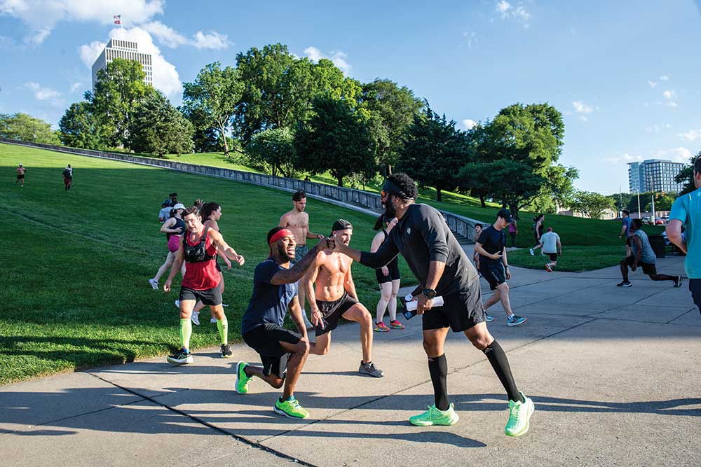 James Crumlin encourages a participant in the Capitol Steps Workout on the grounds of the Tennessee State Capitol in Nashville.