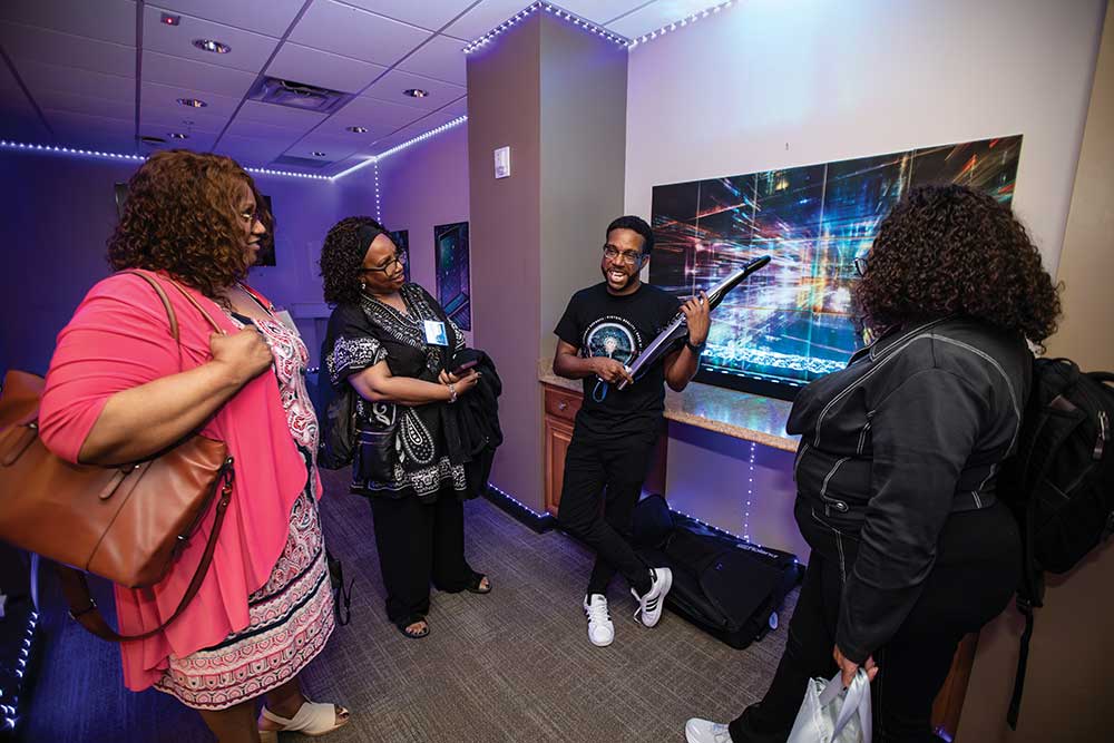 Marcus Horton holds an aerophone musical instrument while giving a tour of the Tennessee State University SMART Center in Nashville.