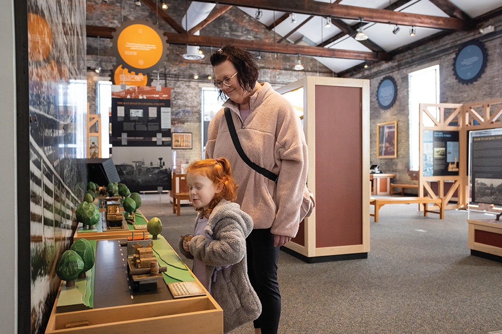 A woman and child interact with exhibits at The Works Ohio Center for Arts and Technology in Newark, Ohio.