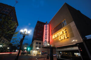 Newton's Cafe lights up at dusk in downtown Waterloo, Iowa.