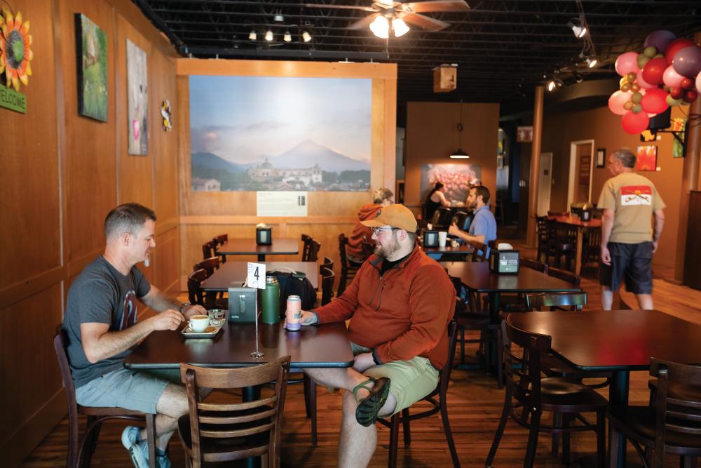 Jeff Palmer, left, and Ryan Kirst eat breakfast and enjoy coffee at Vienna Coffee Company in downtown Maryville. 
